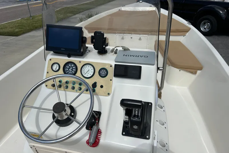Slide: The Image of 1997 Sea Pro SV2100CC Bay Boat dashboard with steering wheel and Garmin navigation system. - 14