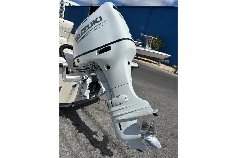 Slide: The Image of 1997 Sea Pro SV2100CC Bay Boat with Suzuki outboard motor in a marina setting. - 3