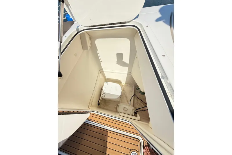 Slide: The Image of 2022 Bayliner Element XR7 boat interior with open hatch and visible storage compartment. - 23