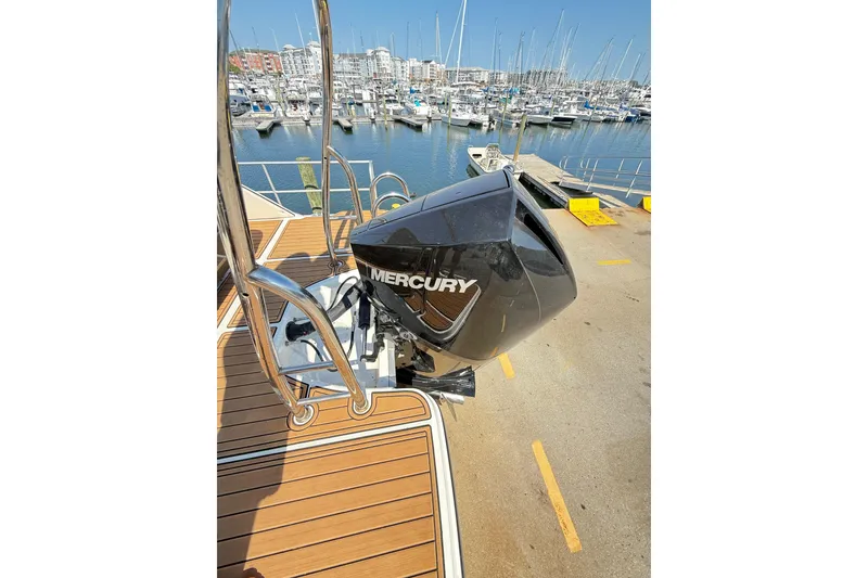 Slide: The Image of 2022 Bayliner Element XR7 with Mercury outboard engine at marina dock. - 26