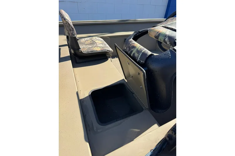 Slide: The Image of 2026 G3 Gator Tough 17 SC boat interior with camo seats and storage compartment. - 10