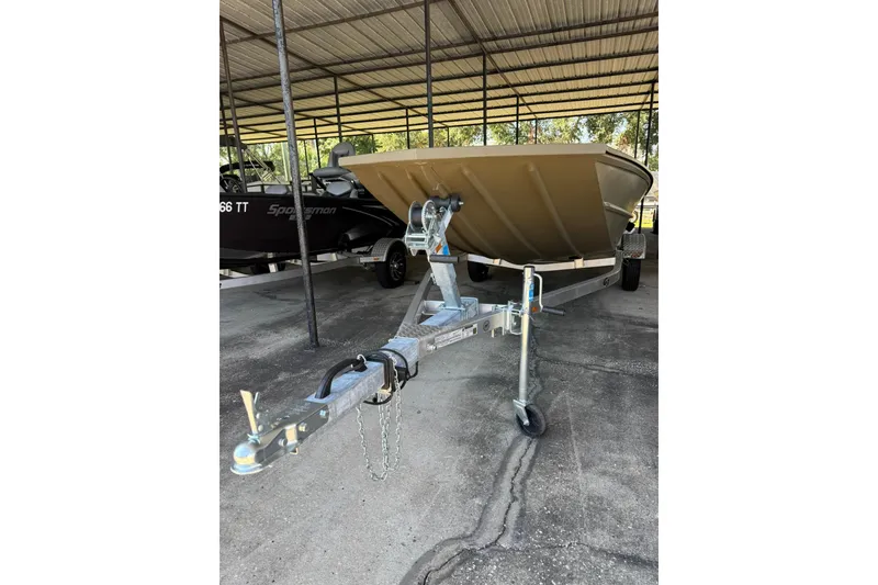 Slide: The Image of 2026 G3 Gator Tough 17 SC boat on trailer under clear blue sky. - 3