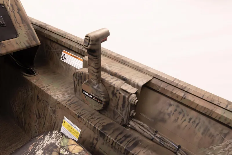 Slide: The Image of 2026 G3 Gator Tough 17 SC boat storage compartments with open lids. - 6