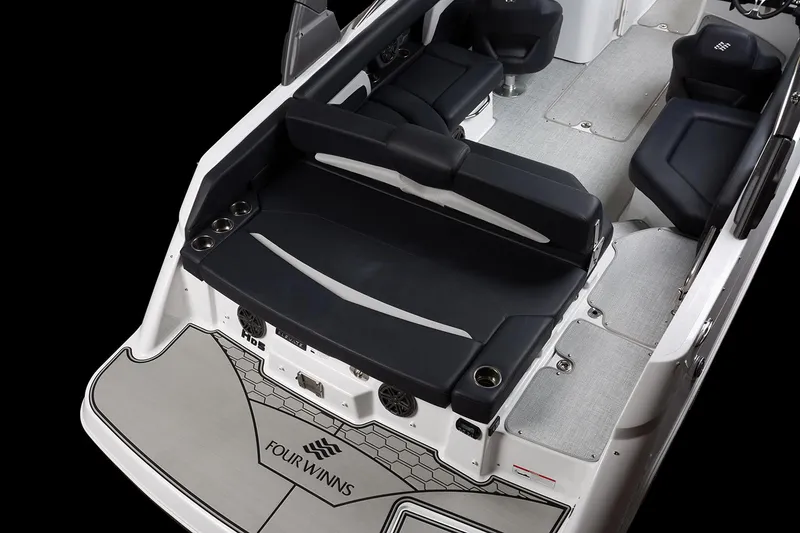 Slide: The Image of 2026 Four Winns HD5 boat interior with tan leather seating and modern design. - 12