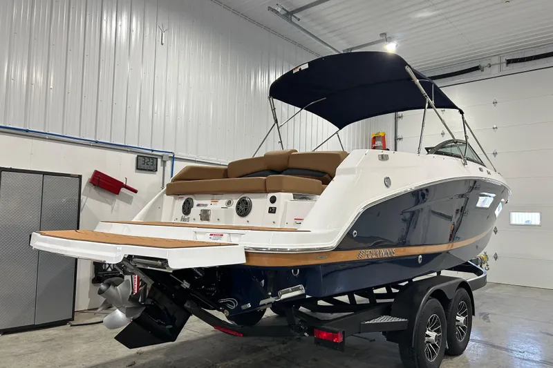 Slide: The Image of 2026 Four Winns HD5 boat dashboard with steering wheel and control panel. - 19