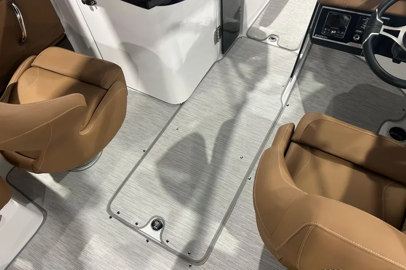 Slide: The Image of 2026 Four Winns HD5 boat interior with compact sink and portable toilet. - 23