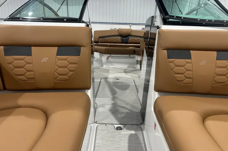 Slide: The Image of 2026 Four Winns HD5 boat interior with tan leather seating and modern design. - 25