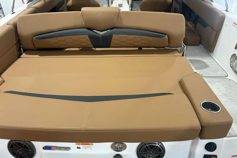 Slide: The Image of Interior view of 2026 Four Winns HD5 boat, featuring helm and seating area. - 27