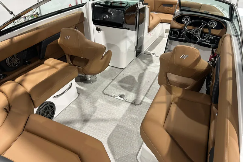 Slide: The Image of 2026 Four Winns HD5 boat interior with tan leather seating and built-in speaker. - 29