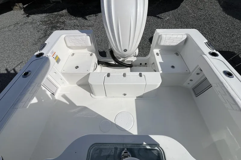 Slide: The Image of 2026 Parker 230 Coastal Elite boat interior, featuring spacious seating and storage compartments. - 4