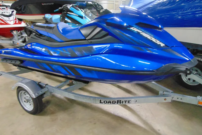 The Image of 2023 Yamaha WaveRunner GP1800R SVHO in blue on a LoadRite trailer. - 2