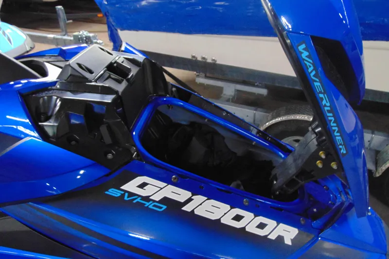Slide: The Image of 2023 Yamaha WaveRunner GP1800R SVHO in vibrant blue, showcasing open storage compartment. - 8