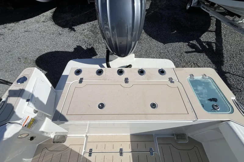 Slide: The Image of 2026 Parker 227 Explorer boat deck with motor and storage compartments. - 4
