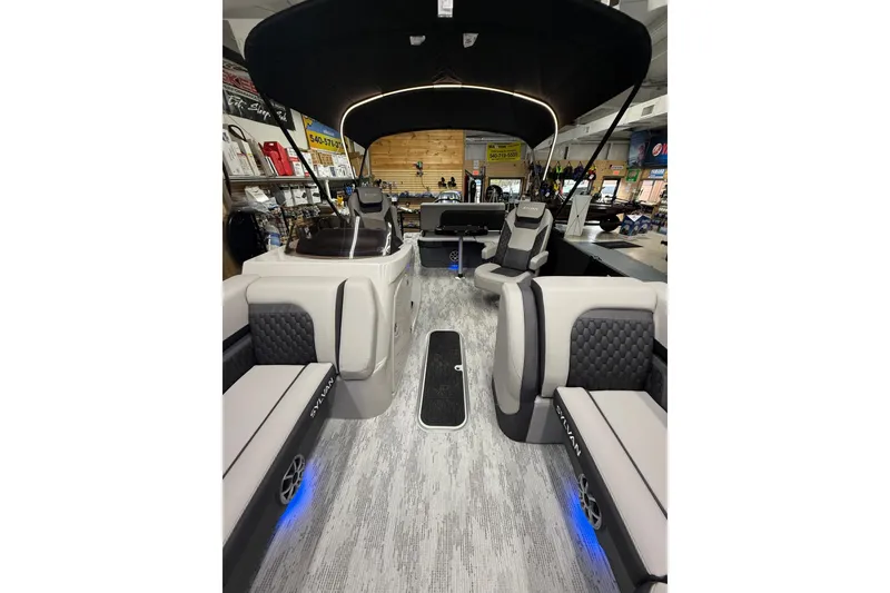 Slide: The Image of Interior of 2026 Sylvan L-3 CLZ DH pontoon boat with modern seating and canopy. - 10
