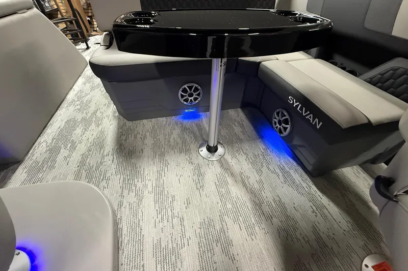 Slide: The Image of Interior of 2026 Sylvan L-3 CLZ DH boat with seating and ambient lighting. - 14