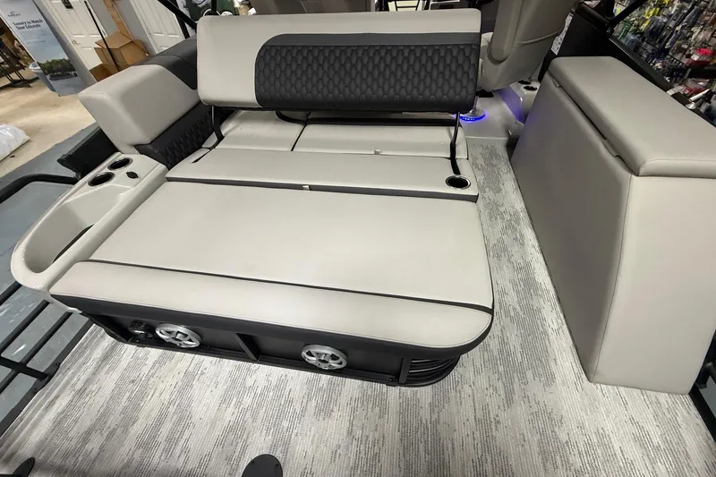 Slide: The Image of 2026 Sylvan L-3 CLZ DH boat interior with convertible seating and cup holders. - 17