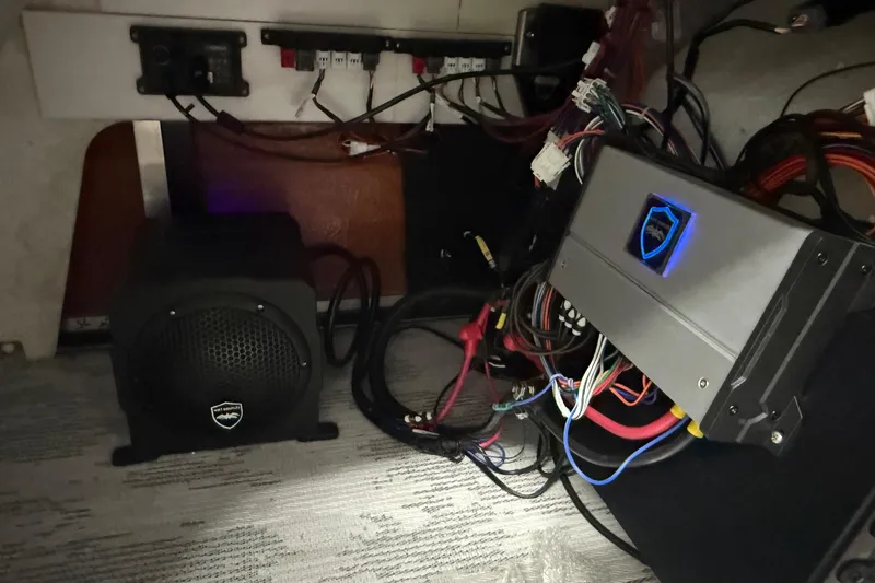 Slide: The Image of 2026 Sylvan L-3 CLZ DH audio system wiring and components in a boat interior. - 24