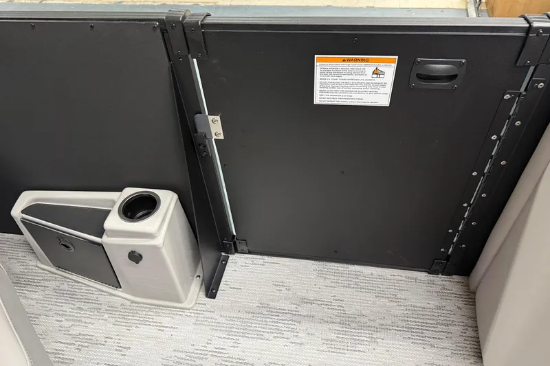 Slide: The Image of Interior of 2026 Sylvan L-3 CLZ DH boat with storage compartment and cup holder. - 26