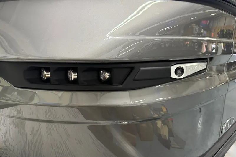 Slide: The Image of Close-up of 2026 Sylvan L-3 CLZ DH boat's sleek exterior design and lighting features. - 3