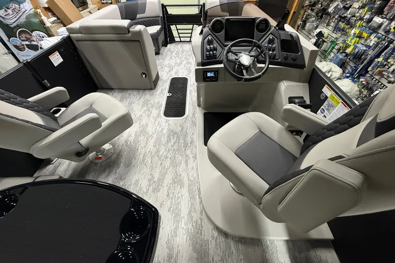 Slide: The Image of Interior of 2026 Sylvan L-3 CLZ DH boat with modern seating and control panel. - 6