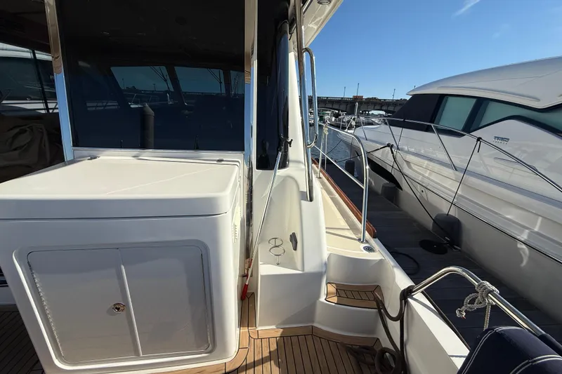 Slide: The Image of 2017 Sabre 48 Salon Express yacht docked, showcasing sleek design and modern features. - 19