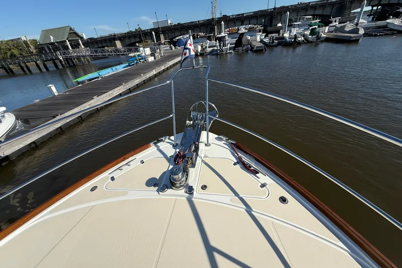 Slide: The Image of Bow view of 2017 Sabre 48 Salon Express docked at marina. - 26