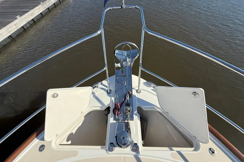 Slide: The Image of Bow view of 2017 Sabre 48 Salon Express yacht with open hatches and railing. - 27