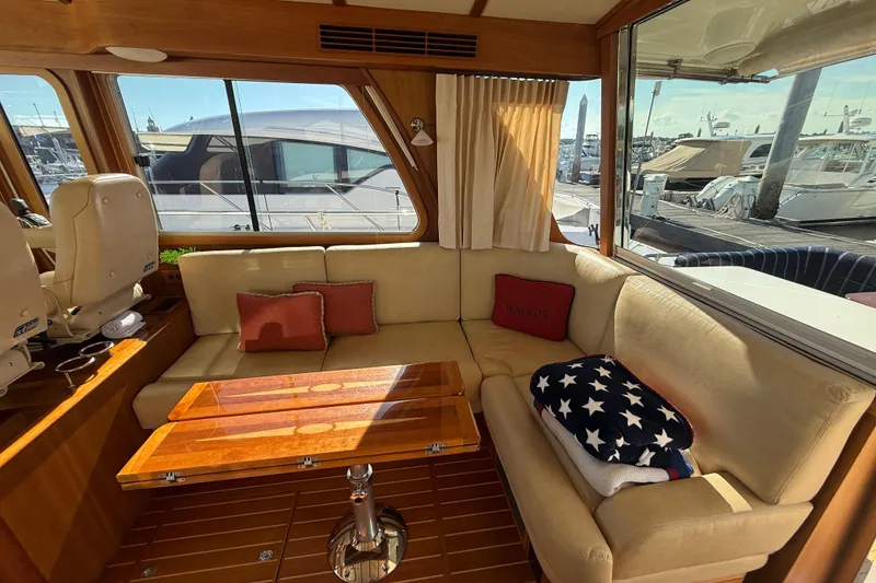 Slide: The Image of Interior of 2017 Sabre 48 Salon Express yacht with cozy seating and wooden table. - 32