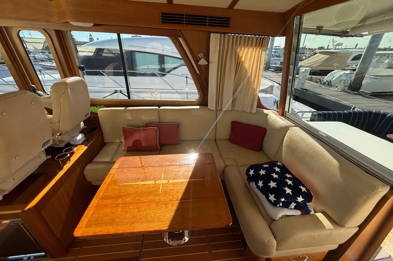 Slide: The Image of Interior of 2017 Sabre 48 Salon Express with cozy seating and wooden table. - 33