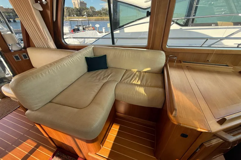 Slide: The Image of Interior of 2017 Sabre 48 Salon Express with beige seating and wooden accents. - 37
