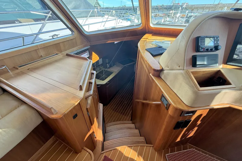 Slide: The Image of Interior of 2017 Sabre 48 Salon Express yacht with wooden finishes and navigation equipment. - 38