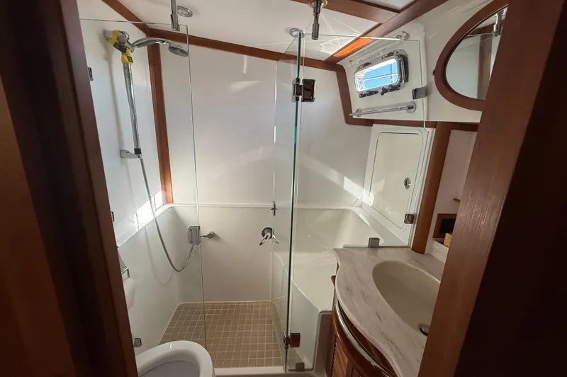 Slide: The Image of Luxurious bathroom in 2017 Sabre 48 Salon Express yacht with glass shower and modern fixtures. - 44