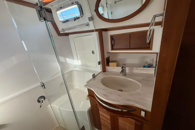 Slide: The Image of Bathroom interior of 2017 Sabre 48 Salon Express yacht with sink and shower. - 45