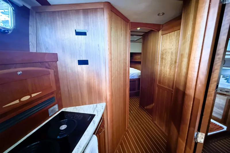 Slide: The Image of Interior of 2017 Sabre 48 Salon Express yacht with wooden cabinetry and modern amenities. - 48