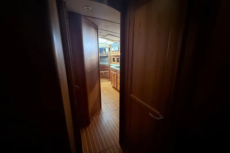 Slide: The Image of Interior view of 2017 Sabre 48 Salon Express yacht, featuring wooden cabinetry and flooring. - 52
