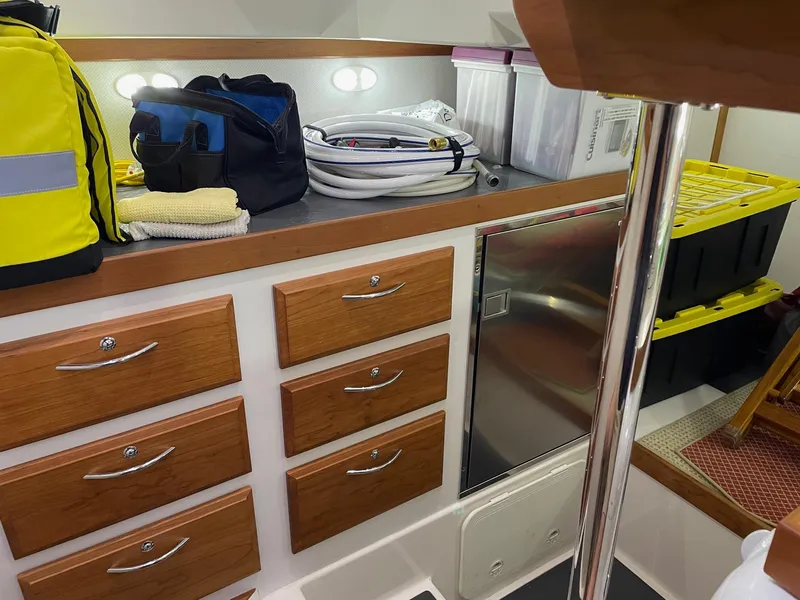 Slide: The Image of Interior of 2017 Sabre 48 Salon Express with storage drawers and equipment. - 56