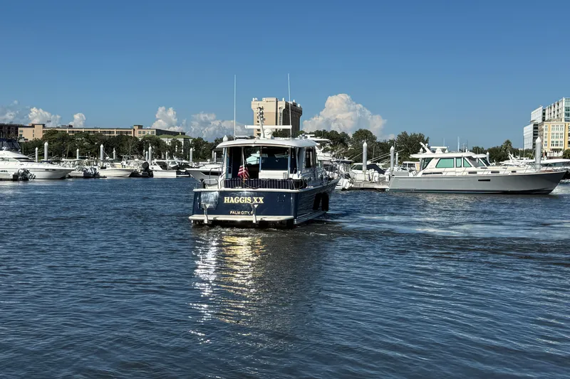 Slide: The Image of 2017 Sabre 48 Salon Express yacht on a sunny marina day. - 9