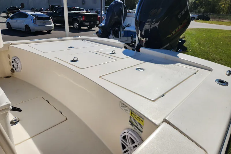 Slide: The Image of 2015 Pathfinder 2300 HPS boat with Yamaha outboard engines, parked outdoors. - 12