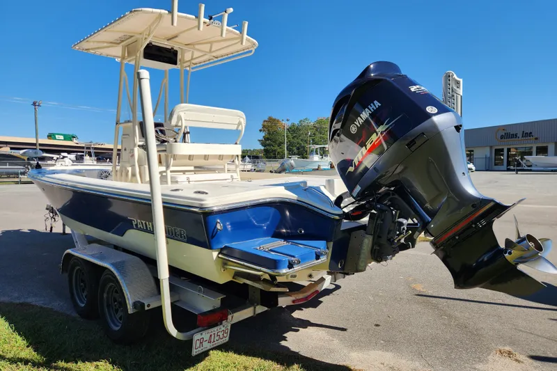 Slide: The Image of 2015 Pathfinder 2300 HPS boat with Yamaha outboard motor on trailer. - 4