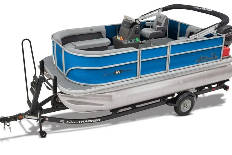 Slide: The Image of 2026 Sun Tracker Party Barge 16 DLX pontoon boat on trailer, blue and silver design. - 3