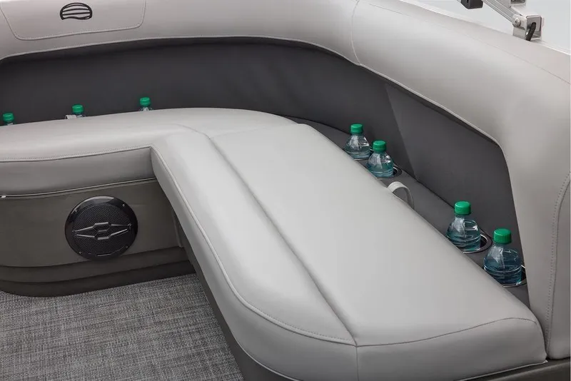 Slide: The Image of Interior seating of 2026 Sun Tracker Party Barge 16 DLX with cup holders and speaker. - 6