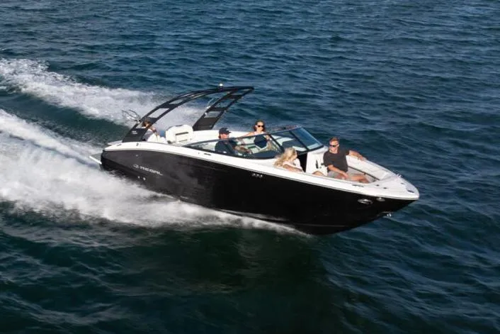 The Image of Manufacturer Provided Image: 2026 Regal LS6 Surf boat cruising on open water with passengers. - 0