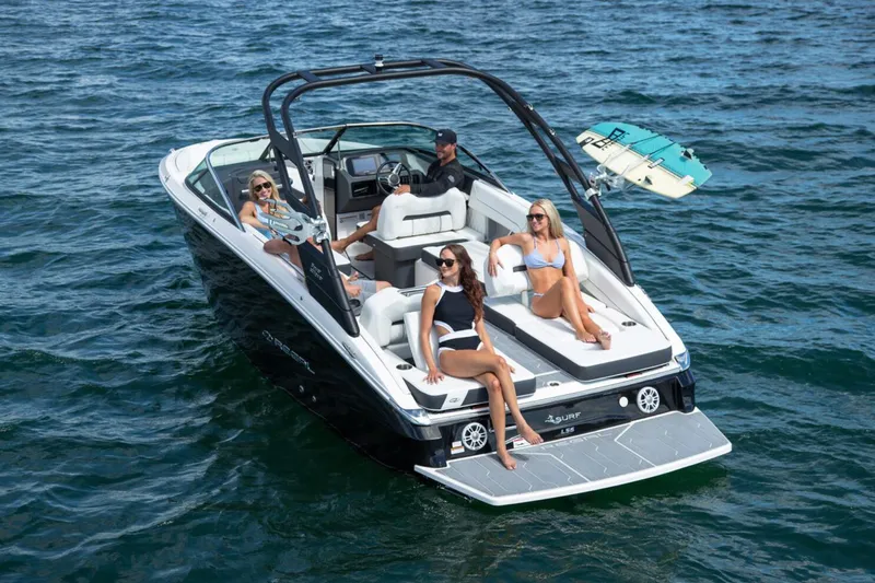 Slide: The Image of Manufacturer Provided Image: 2026 Regal LS6 Surf boat with passengers enjoying a sunny day on the water. - 2