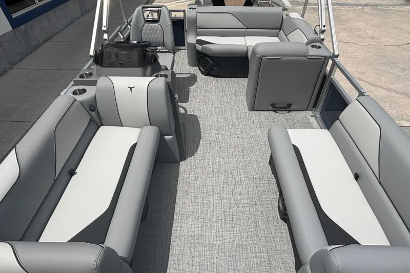 Slide: The Image of 2026 Tahoe Pontoon 1780 interior with gray seating and carpeted floor. - 5