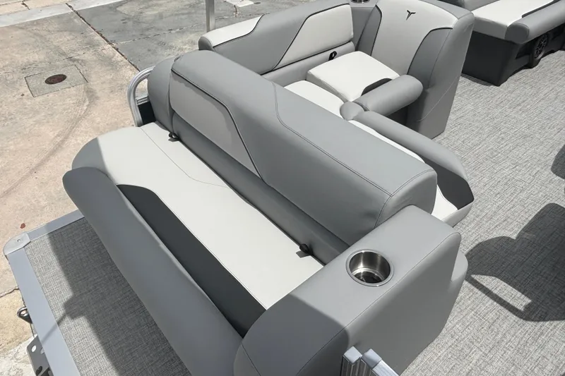Slide: The Image of 2026 Tahoe Pontoon 1780 boat interior with gray seating and cup holders. - 9