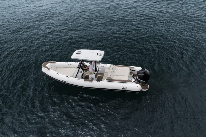 Slide: The Image of Aqvaboats Luxrib 25, 2026 model, cruising on open water. - 20