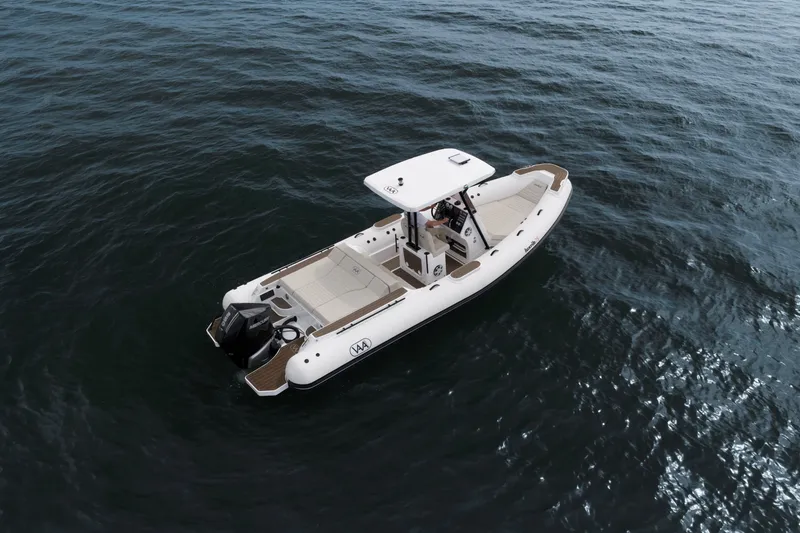 Slide: The Image of Aqvaboats Luxrib 25, 2026 model, cruising on open water. - 22