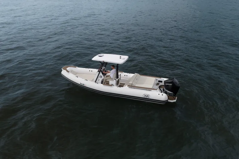 Slide: The Image of Aqvaboats Luxrib 25 (2026) cruising on open water, showcasing sleek design and modern features. - 23