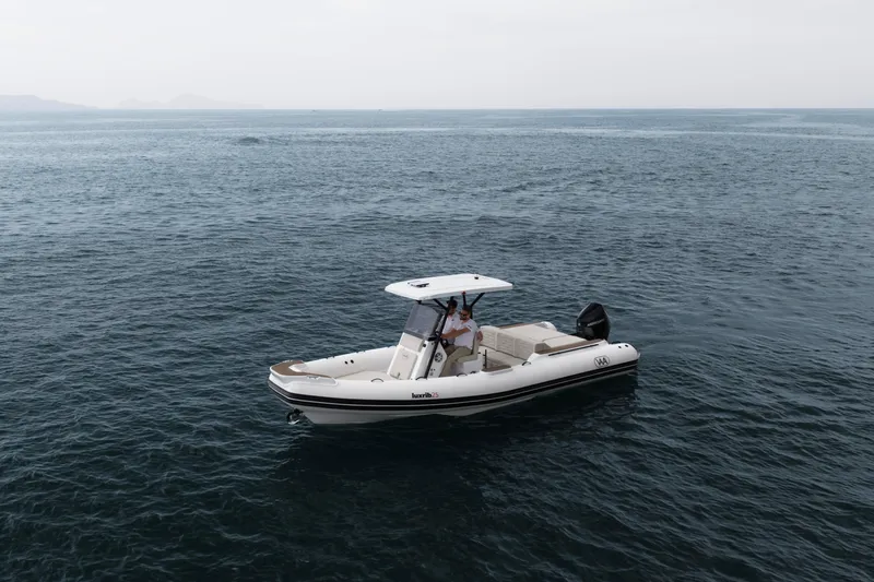 Slide: The Image of Aqvaboats Luxrib 25 (2026) cruising on open water, showcasing sleek design and modern features. - 24