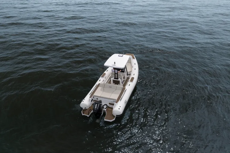 Slide: The Image of Aqvaboats Luxrib 25 (2026) cruising on open water, showcasing sleek design and modern features. - 28